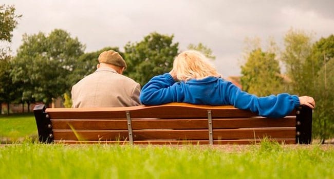 People sitting on a park bench