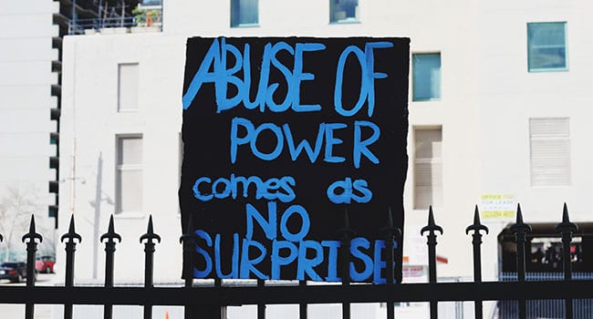 Abuse of power sign