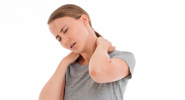 Woman massaging her sore neck