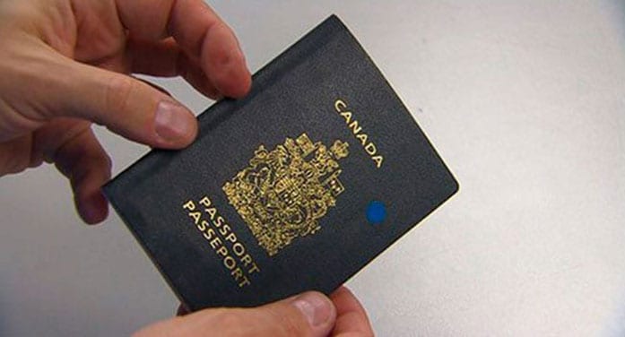 Man holding his Canadian passport