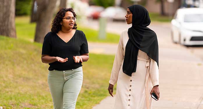 Juanita Gnanapragasam (left) and SafeWalk volunteer Asha