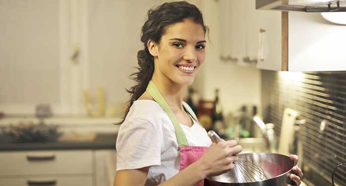 woman cooking baking kitchen food smile