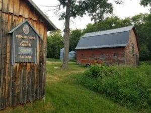 The workshop, left, has the sign from the now-closed United Church.